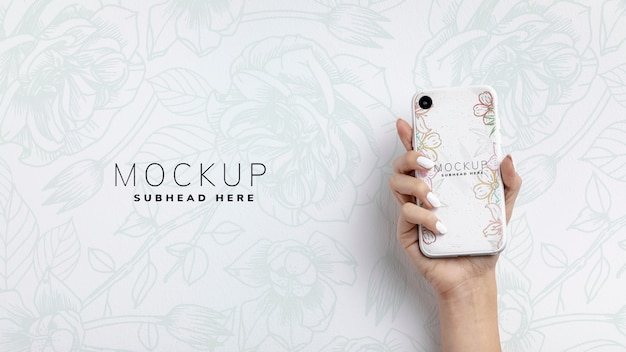 Download Free PSD | Hand holding smartphone with mockup and copy space