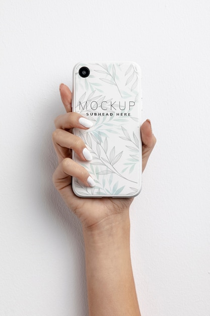 Download Hand holding smartphone with mockup | Free PSD File