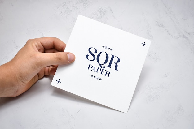 Download Premium Psd Hand Holding Square Brochure Mockup