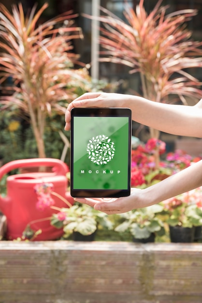 Download Hands holding tablet mockup with gardening concept PSD file | Free Download