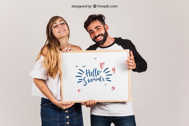 Download Happy couple presenting whiteboard PSD Template