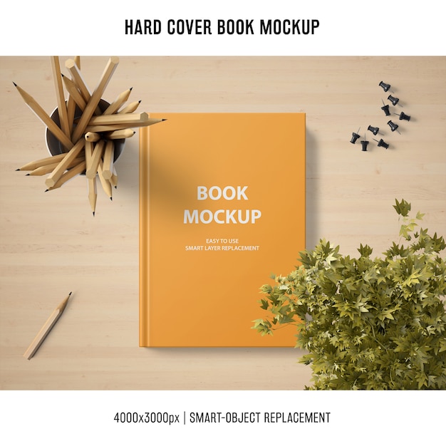Download Hard cover book mockup with plant and pencils PSD file | Free Download