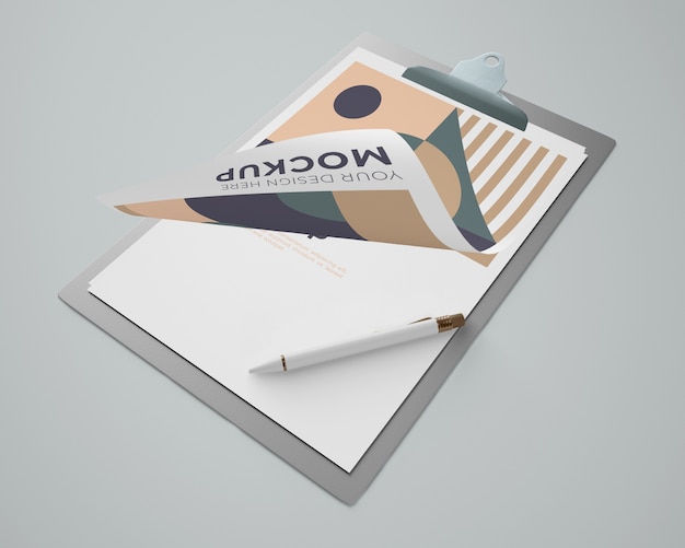 Download High angle of notepad mock-up with geometric design and pen | Free PSD File