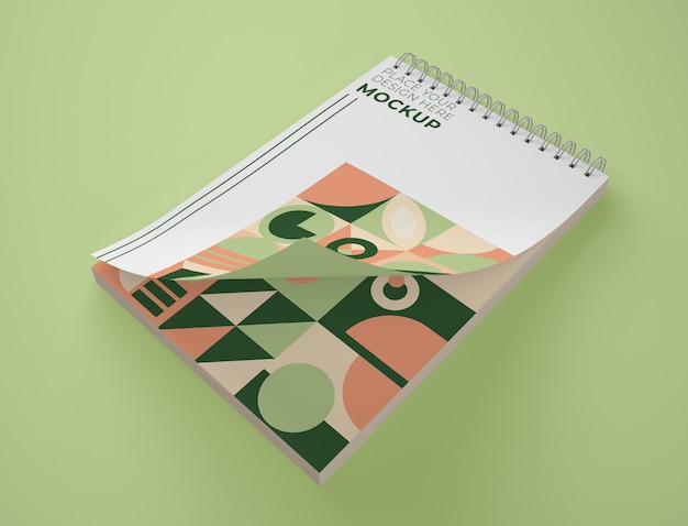 Download High angle of notepad mock-up with geometric design | Free PSD File