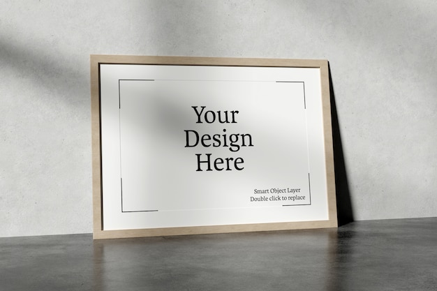Horizontal frame leaning against a wall mockup PSD file | Premium Download
