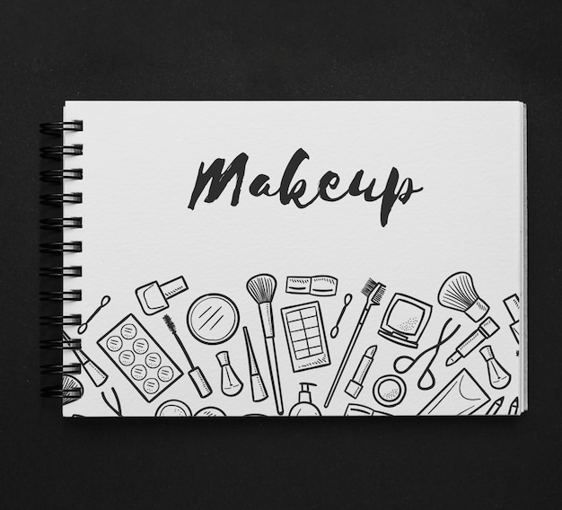 Download Horizontal notepad mockup with makeup drawing | Free PSD File