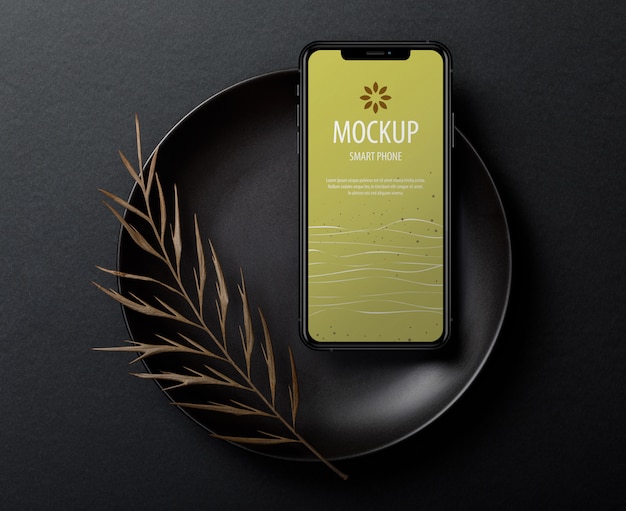 Download Premium PSD | Iphone screen mockup template with dry leaves