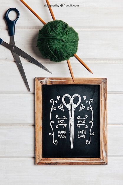 Download Free PSD | Knitting mockup with slate and scissors
