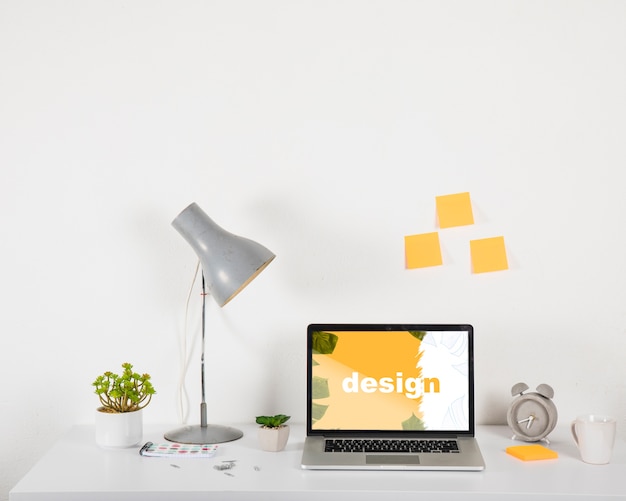 Laptop mockup on desk with elements Free Psd Laptop mockup on desk with elements Free Psd