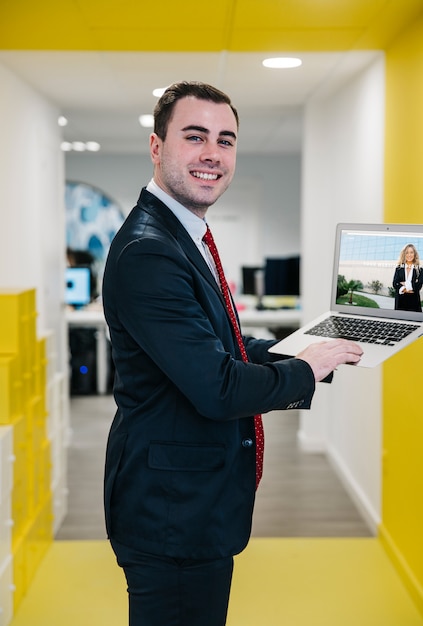 Download Laptop mockup with businessman | Free PSD File