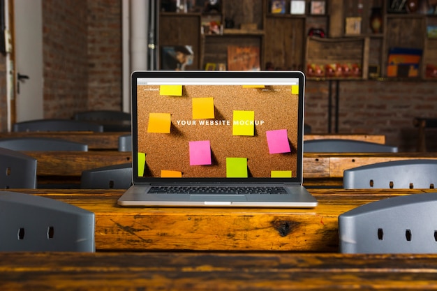 Download Laptop mockup on wooden table | Free PSD File