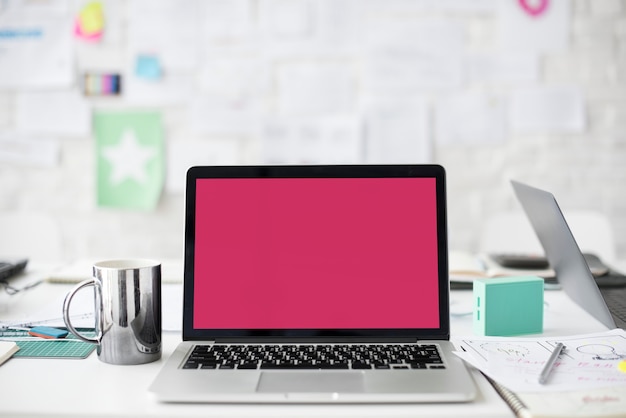 A laptop with a red screen PSD Template