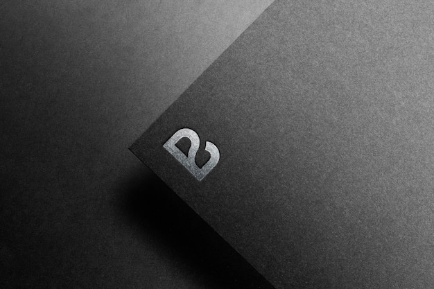 Logo mockup black paper Premium Psd