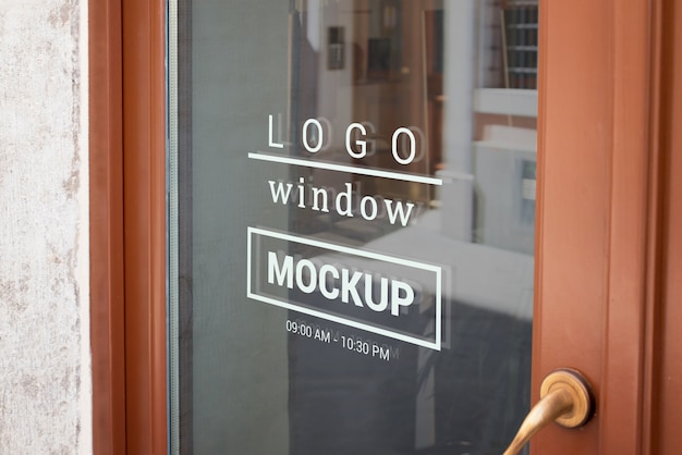 Download Logo mockup on store front door window | Premium PSD File