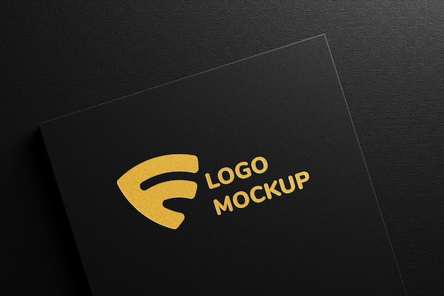 Premium PSD | Luxury embossed gold foil logo mockup on black paper