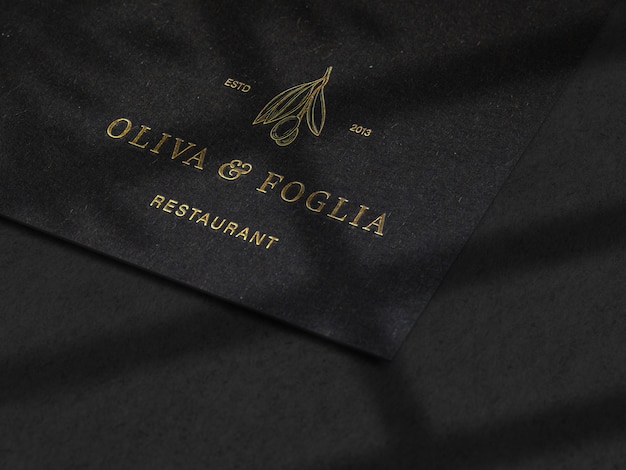 Download Luxury embossed logo mockup on black paper texture | Premium PSD File