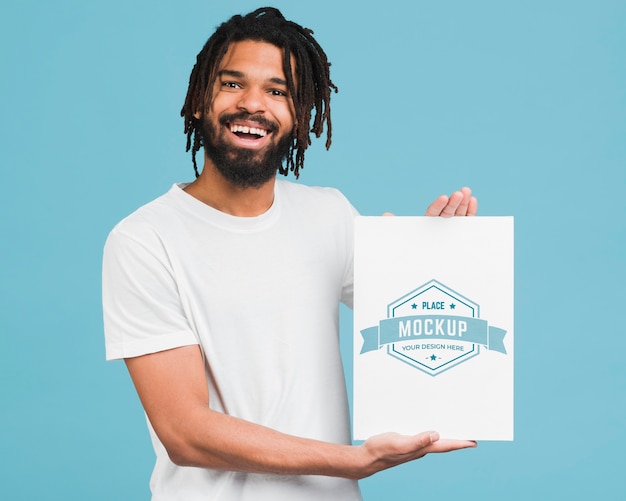 Download Man holding poster mockup | Free PSD File