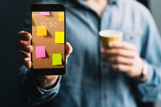 Man showing smartphone template Free Psd