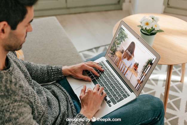 man living room laptop