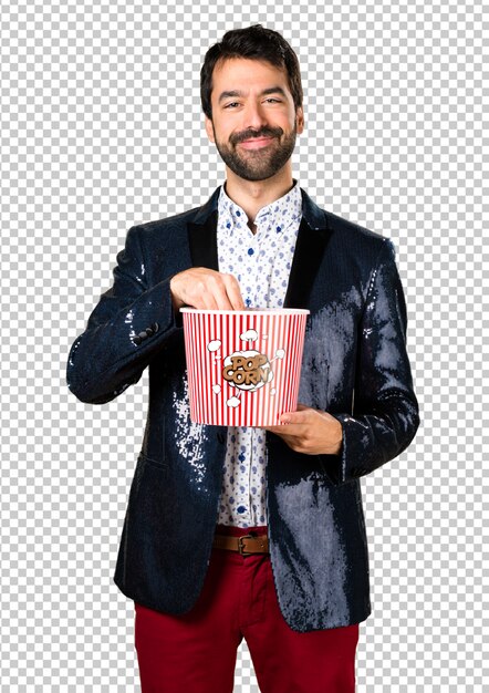 Download Man with jacket eating popcorns | Premium PSD File