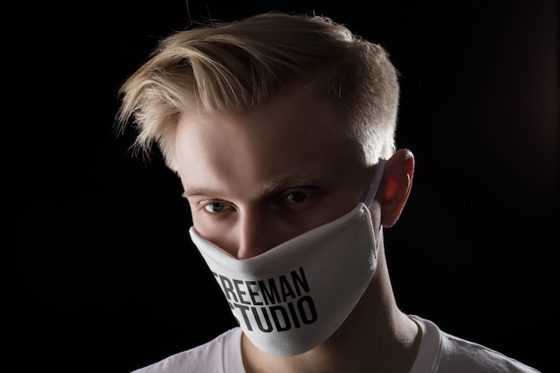 Download Men in medicine mask on black background mock-up | Premium ...
