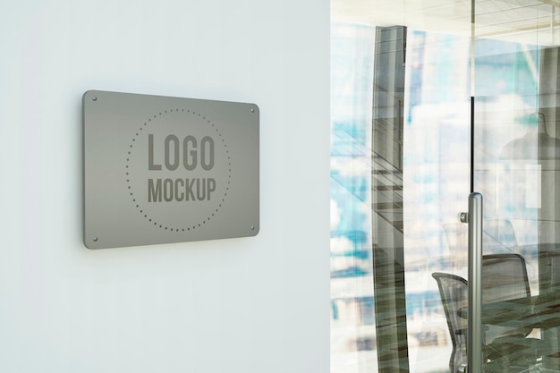 Premium PSD | Metal plate on office wall mockup