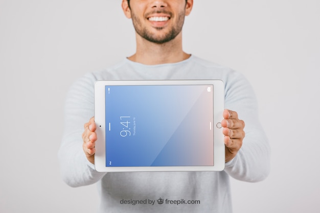 Download Free Psd Mock Up Design With Man Holding Horizontal Tablet