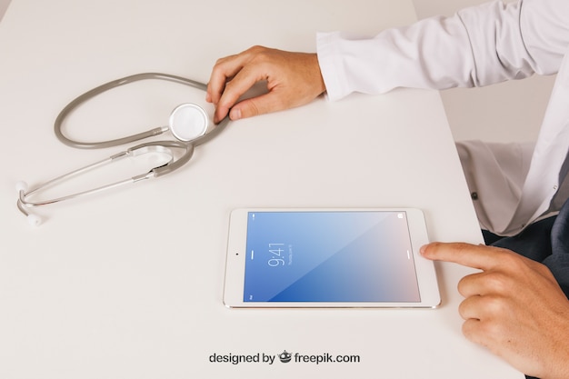 Free PSD | Mock up design with medical doctor working with tablet