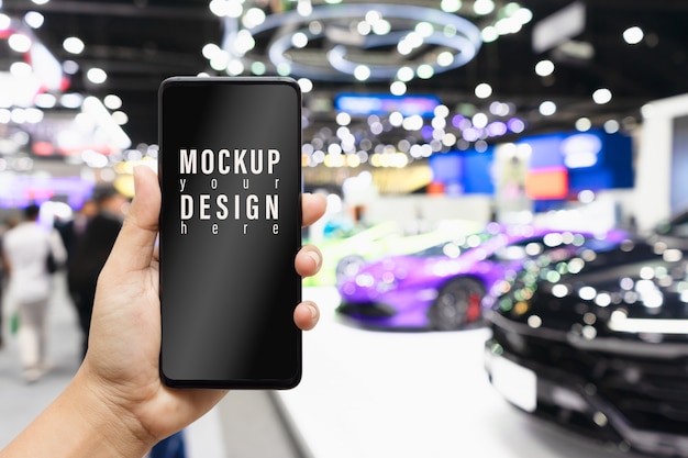 Download Mock up mobile phone with blurred image of public event exhibition hall | Premium PSD File