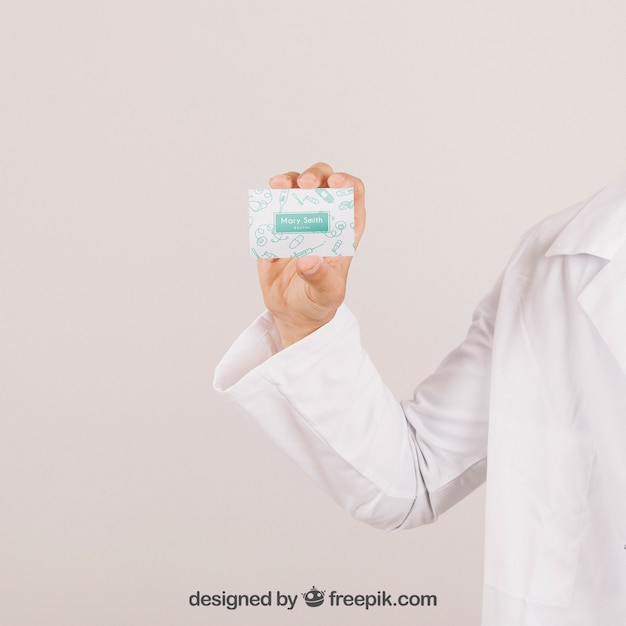 Download Mock up with doctor's hand holding a visiting card PSD file | Free Download