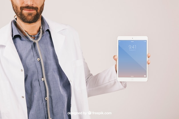 Download Free PSD | Mock up with doctor, stethoscope and tablet