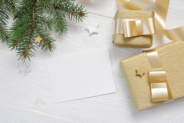 Download Mockup christmas gift box and fir tree top view and gold ribbon, flatlay | Premium PSD File