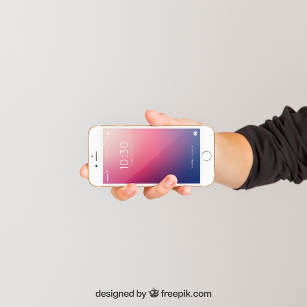 Download Mockup concept of hand holding smartphone horizontal PSD file | Free Download