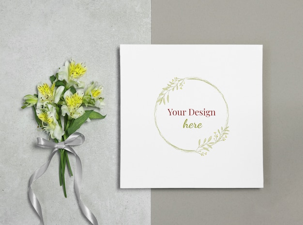 Download Mockup frame on grey beige background with bouquet of flowers | Premium PSD File