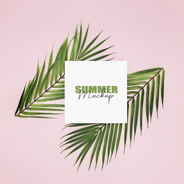 Download Free PSD | Mockup frame with palm leaves over pink background