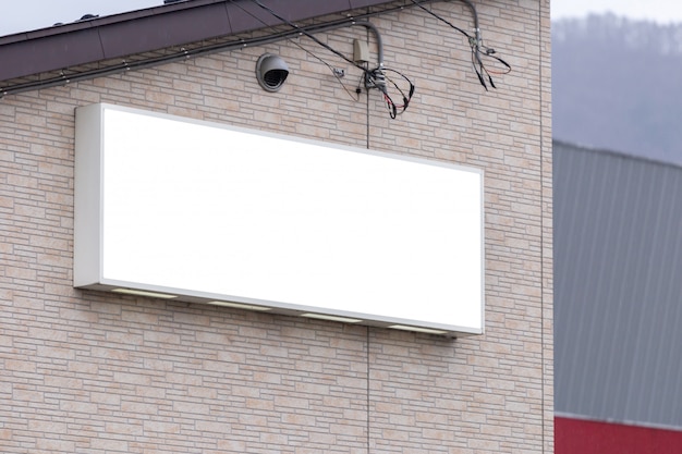 Download Premium PSD | Mockup image of blank billboard white screen posters and led outside storefront ...