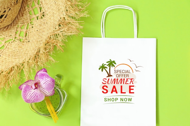 Download Mockup paper package with straw hat on green background ...