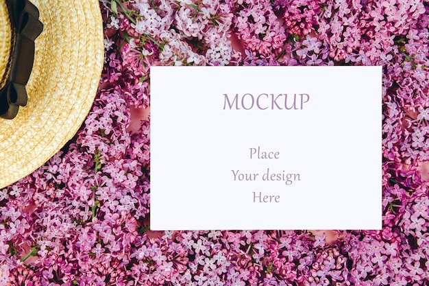 Download Mockup postcard on a background of lilac twigs and a straw ...