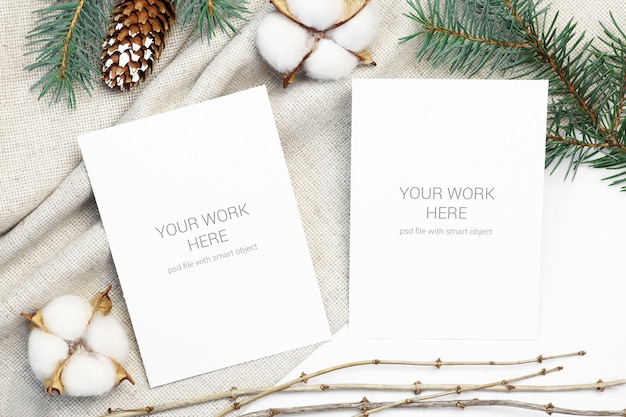 Mockup postcard with cotton, cone and conifer branch Premium Psd