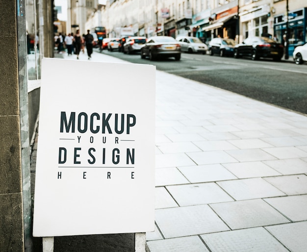 Mockup poster on the outside of a shop PSD Template