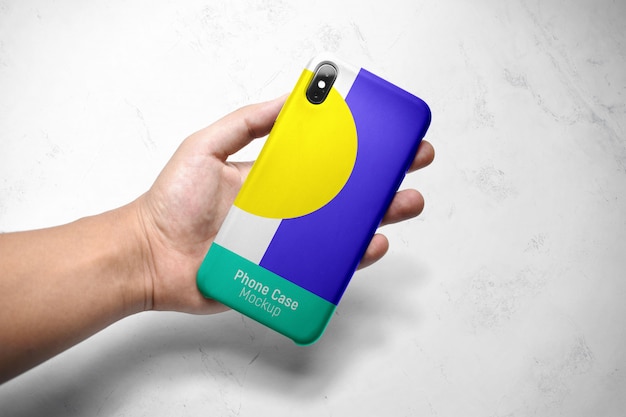 Download Mockup of a smartphone case in hand | Premium PSD File PSD Mockup Templates