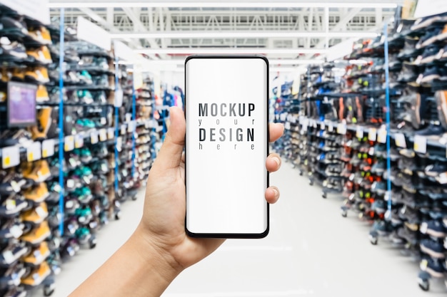 Download Mockup smartphone with sport shoes on shelves in shop ...
