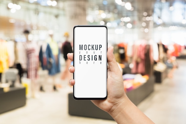Download Premium Psd Mockup Of Smartphone In Women Clothing Fashion Shop