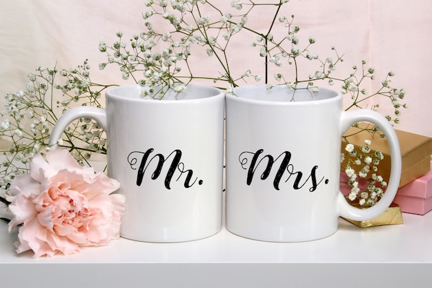 Download Mockup of two white coffee mugs with flowers | Premium PSD ...