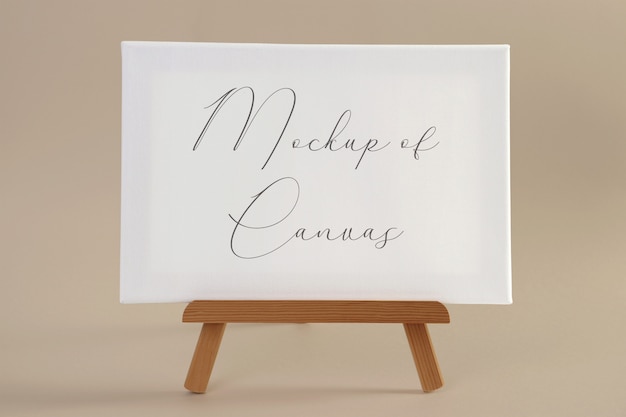 Download Premium PSD | Mockup of a white canvas on a small wooden easel