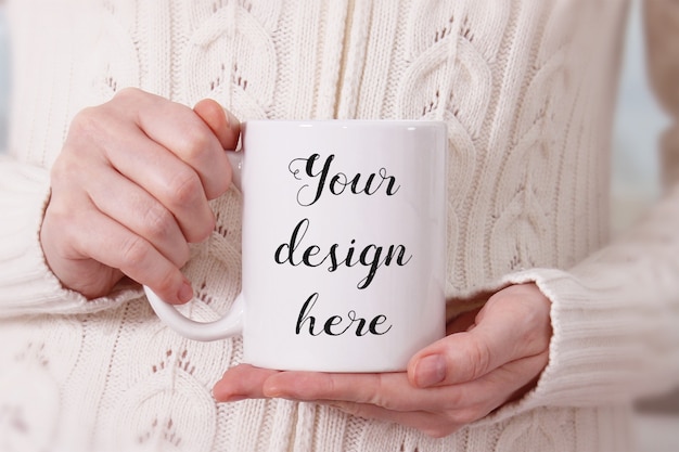 Download Mockup of a white coffee mug in woman's hands | Premium ...