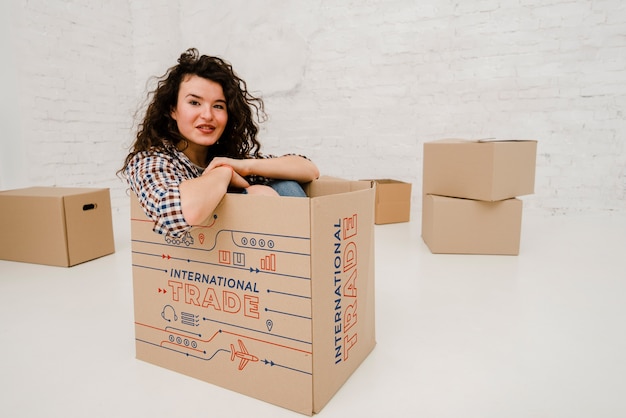 Download Mockup of woman with cardboard boxes PSD file | Free Download