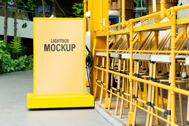 Download Mockup of yellow light box in a city for your advertising ...