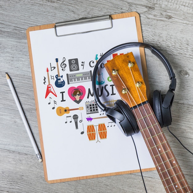 Free PSD Music Mockup With Guitar On Clipboard