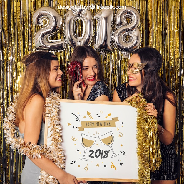 Download New year mockup with three girls holding whiteboard | Free PSD File